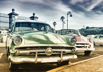 Old car parked in a street of Havana with bicolor tone efect - 335702207