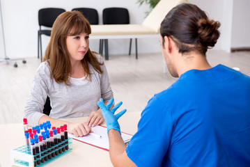 Young woman in blood transfusion concept
