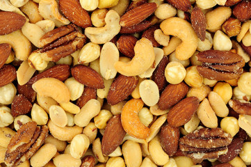 Roasted salted mixed nuts flavourful snacking background