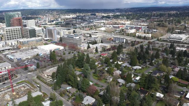 Aerial / drone footage of abandoned streets, without any pedestrians, shoppers in downtown and commercial, business district of Belleview near Seattle, Washington