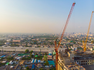Construction site building with crane high rise condominium sunset light