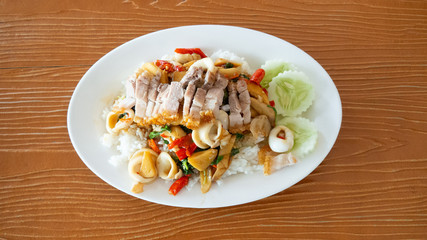 Stir fried squid basil on top with crispy pork. Street food in Thailand, delicious Thai food