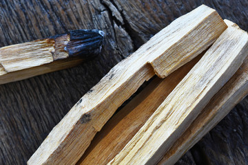 A close up image of palo santo smudge sticks used for energy clearing and healing. 