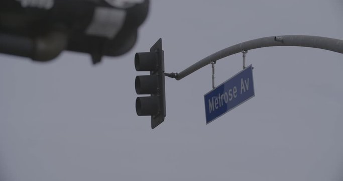 Melrose Avenue Street Signs LA Blue 4K Slow Motion Red Green Traffic Light