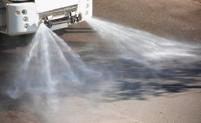 Disinfection truck - Cleaning ( truck) sweeper machines washes the city asphalt road