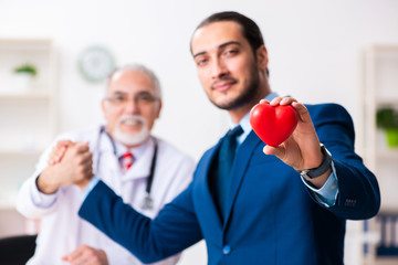 Male doctor and businessman discussing medical project