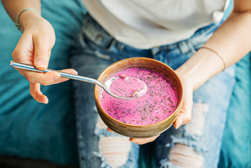 woman eating cold beetroot soup