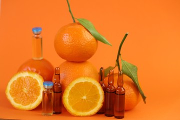 Vitamin C prevention of immunity from viruses.Vitamin C set of ampoules and fresh oranges and...