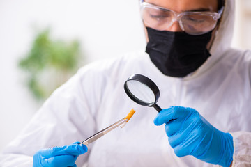 Male expert criminologist working in the lab for evidence