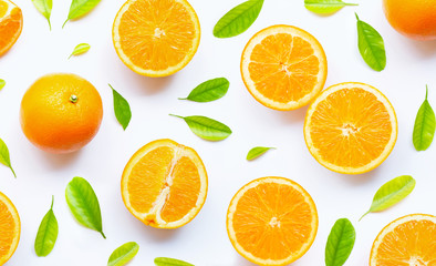 Fototapeta na wymiar High vitamin C, Juicy and sweet. Fresh orange fruit with green leaves on white.