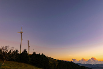 wind turbines at sunset