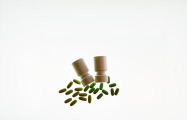Medicine and vitamin tablets isolated against a white background