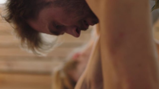 Girlfriend teaching boyfriend how to do yoga at home, lauging and cheering each other. Stay home, quarantine workout. Shot on ARRI Alexa Mini