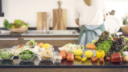 Various fresh vegetables which are raw ingredients for salad.Concept of happy family, modern kitchen.