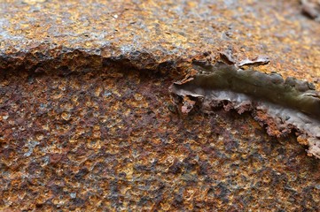 Close up a steel damage from rusty oxidation.