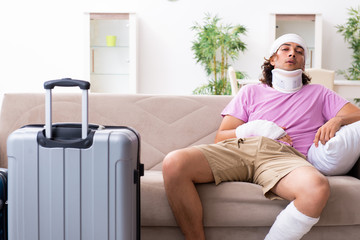 Young injured man preparing for the trip