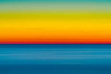 Fototapeta na wymiar Artistic shot of sunset shot with long exposure and intentional movement photo technique. 