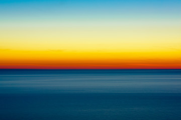 Artistic shot of sunset shot with long exposure and intentional movement photo technique. 