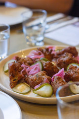 Vegetarian zucchini fritters with pickled vegetables