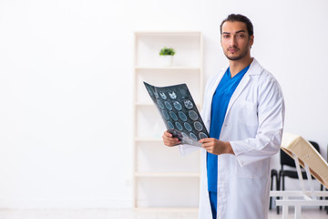 Young male doctor working in the clinic