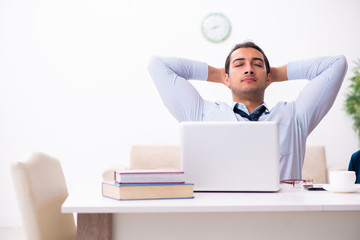 Young male employee working from house