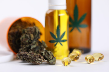 On table marijuana in jar and hemp oil in capsules. Help for cancer patients. Medical cannabis...