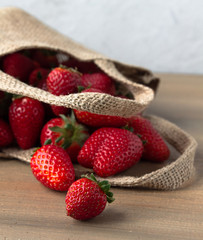 Woven brown bag of ripe strawberries