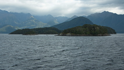 Cloudy weather on Lake Manapouri in Fiordland National Park in Southland on South Island of New Zealand
