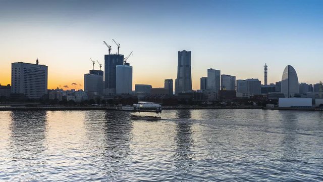 Time laps day to night of cityscape view at Yokohama bay Japan