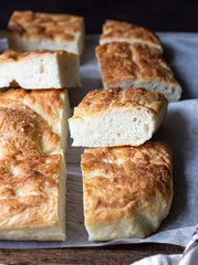 Traditional Italian focaccia bread with salt and olive oil. Homemade flat bread focaccia. Focaccia Genovese. 