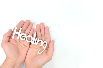 Human hands praying for healing. Heal the world, covid-19 coronavirus crisis.