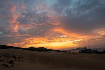 Naklejka na ściany i meble sunset over the dunes mui ne vietnam asia