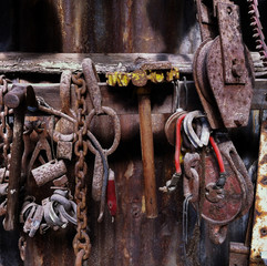 Close up details of various vintage tools and other pieces of equipment in a workshop