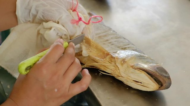 Traditional process of making salted dried threadfin fish, local premium product of Pattani.