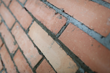 Unfinished wall tiled with rectangular bricks groomed to become smooth and easy to hang...