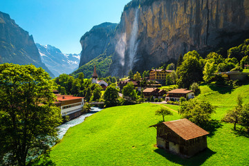 Gorgeous tourist mountain village with waterfalls and traditional buildings, Lauterbrunnen