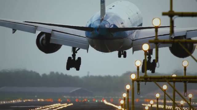 Passenger airplane landing towards the runway