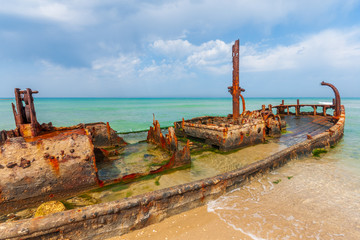 Rusty shipwreck on Habonim shore, Israel