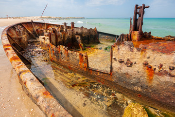 Fototapeta na wymiar Rusty shipwreck on Habonim shore, Israel