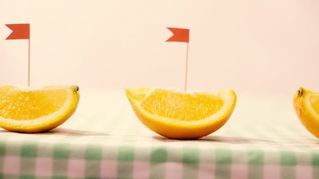 The concept of healthy food. Orange, vitamin C. boat in the form of an orange. Marine theme in food