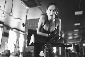 Woman having rest after hyperextension, monochrome.