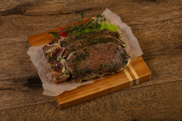 Raw marinated pork steak