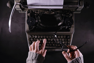 Vintage journalist tool. Typewriter retro. The writer is at work. Seal of the novel. Journalist writer concept.