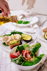 Akavado with cherry tomatoes, mozzarella, basil with olive oil. Healthy food. Selective focus. Vegetarian food