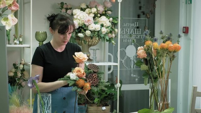 The work of the florist. Composing a bouquet