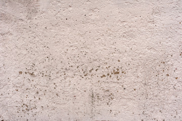 Texture of a concrete wall with cracks and scratches which can be used as a background