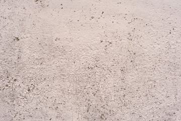 Texture of a concrete wall with cracks and scratches which can be used as a background