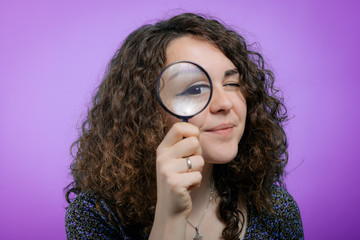 Woman with magnifying glass