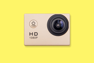 HD action camera isolated on yellow background