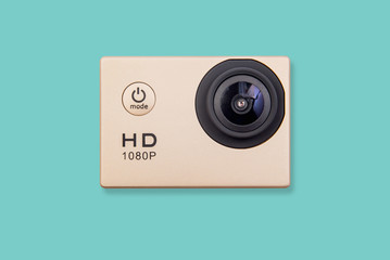 HD action camera isolated on green pastel background